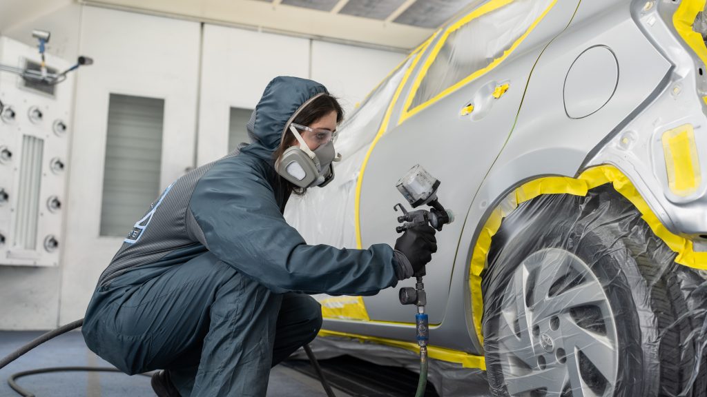 Vehicle being painted at Acme Auto Powered by VIVE